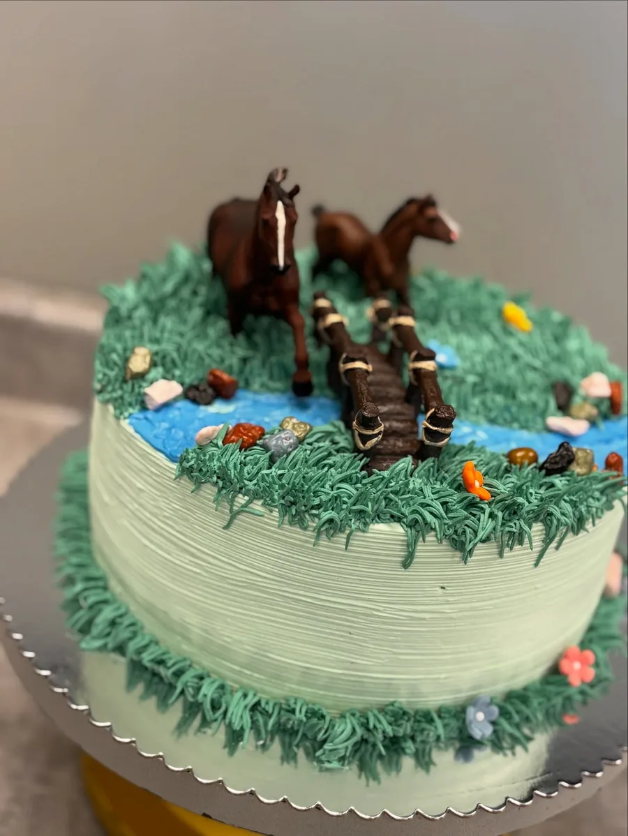 Custom birthday cake decorated as a horse pasture with buttercream grass