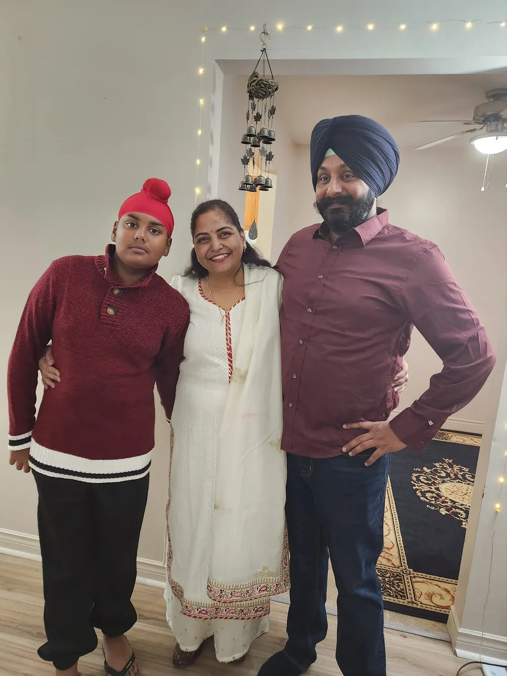 Harpreet, Amardeep and their son at home